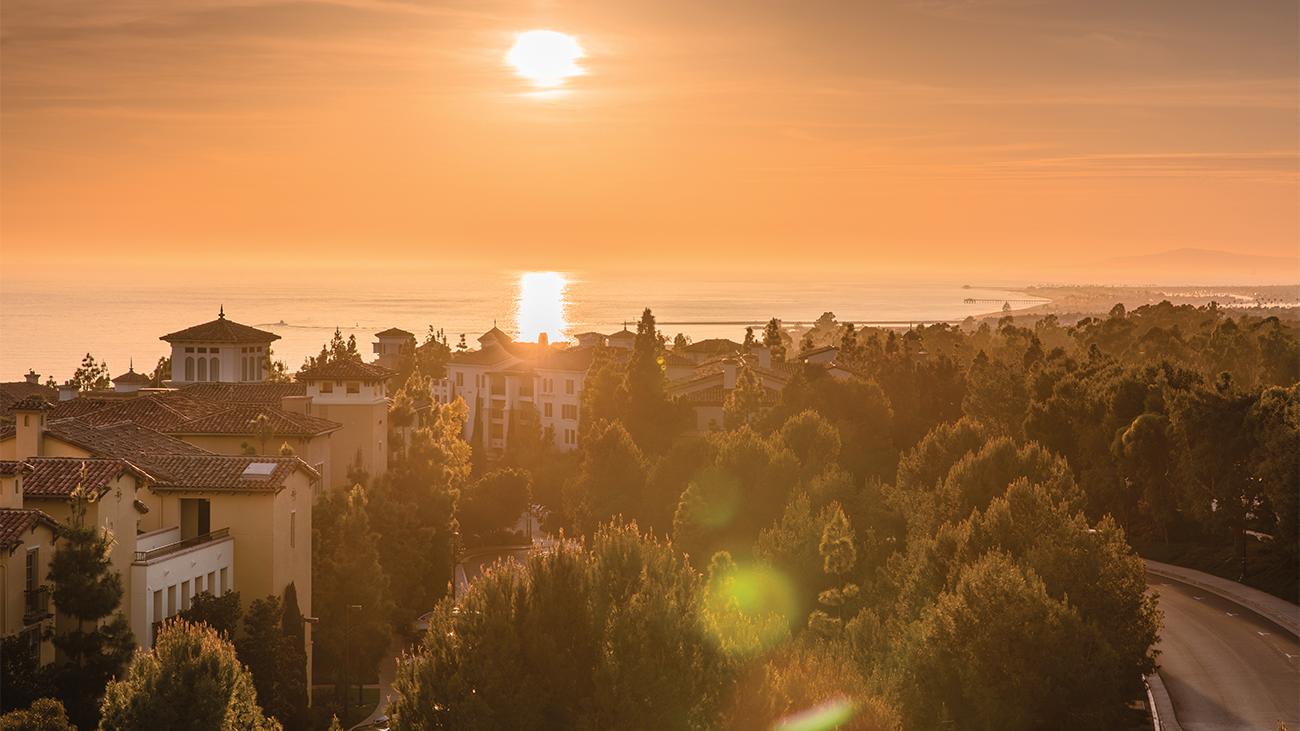 Exterior of Marriott's Newport Coast Villas resort timeshare with sun setting over water